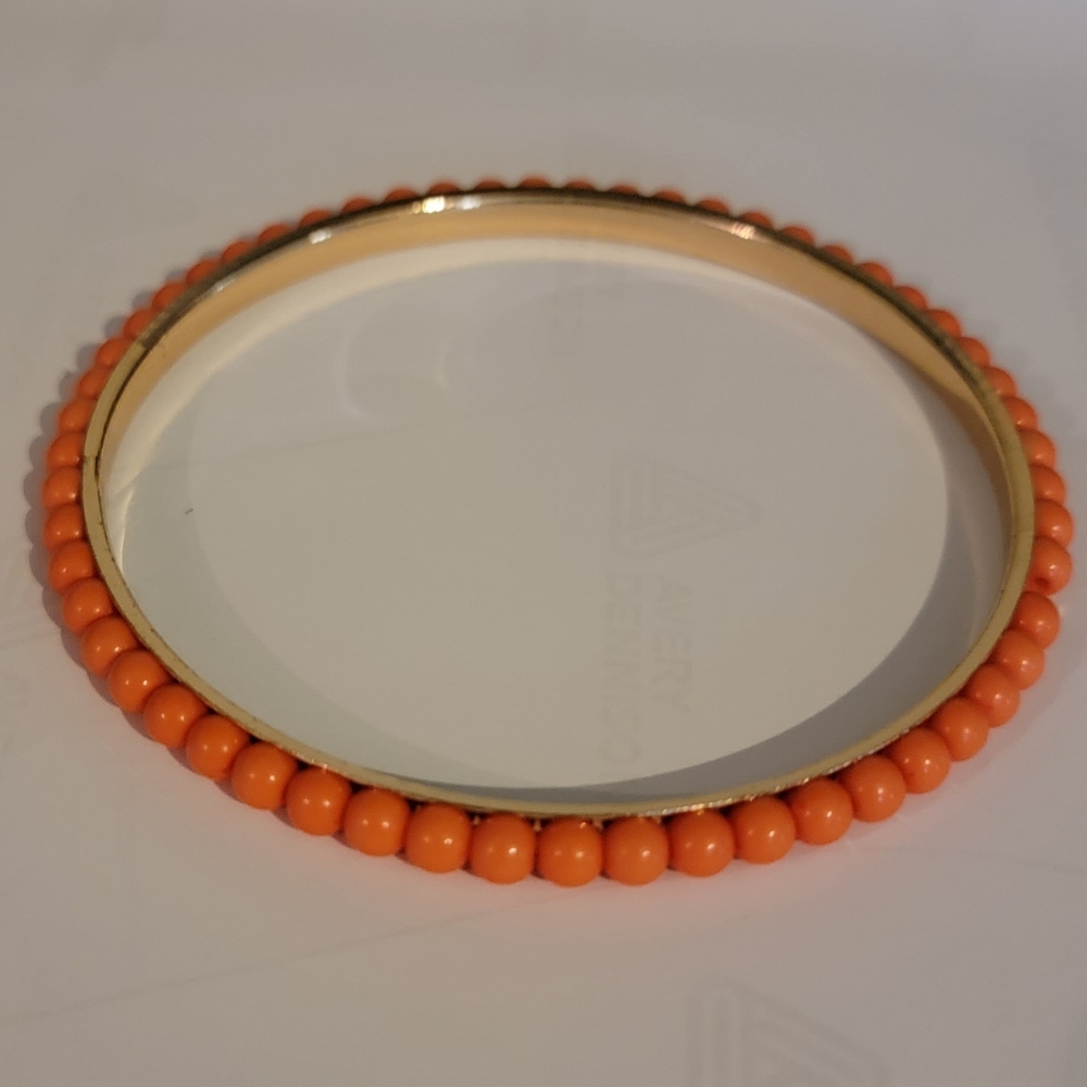 Coral colored bead gold bracelet